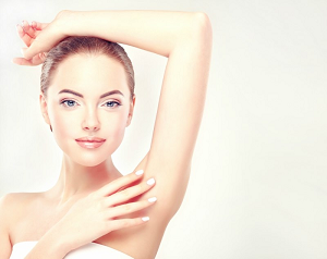 Armpit epilation lacer hair removal. Young woman holding her arms up and showing clean underarms depilation smooth clear skin .Beauty portrait.